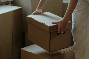 Person packing cartons